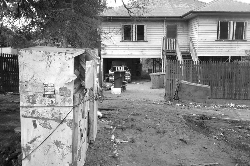 Residential flood damage with water line and ruined contents